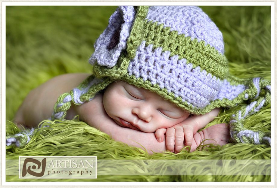 baby girls picture with aviator hat and flower