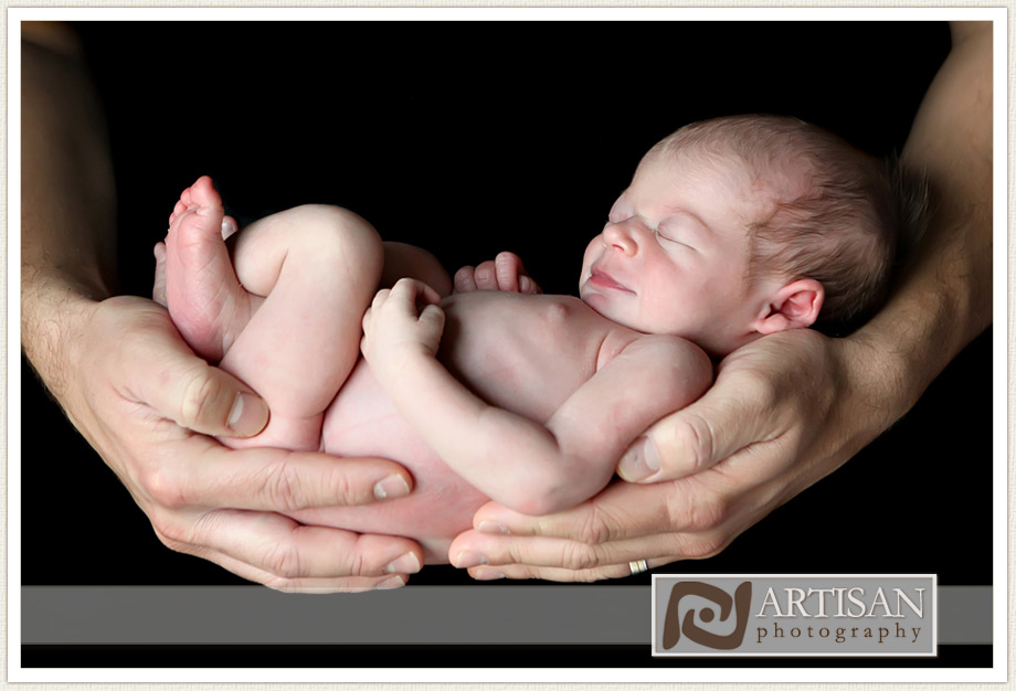 baby in father's hand