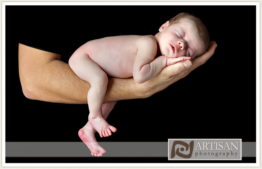 baby girl in father's hands