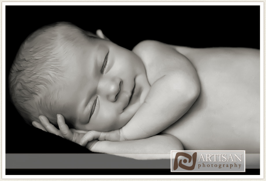 newborn baby smiling