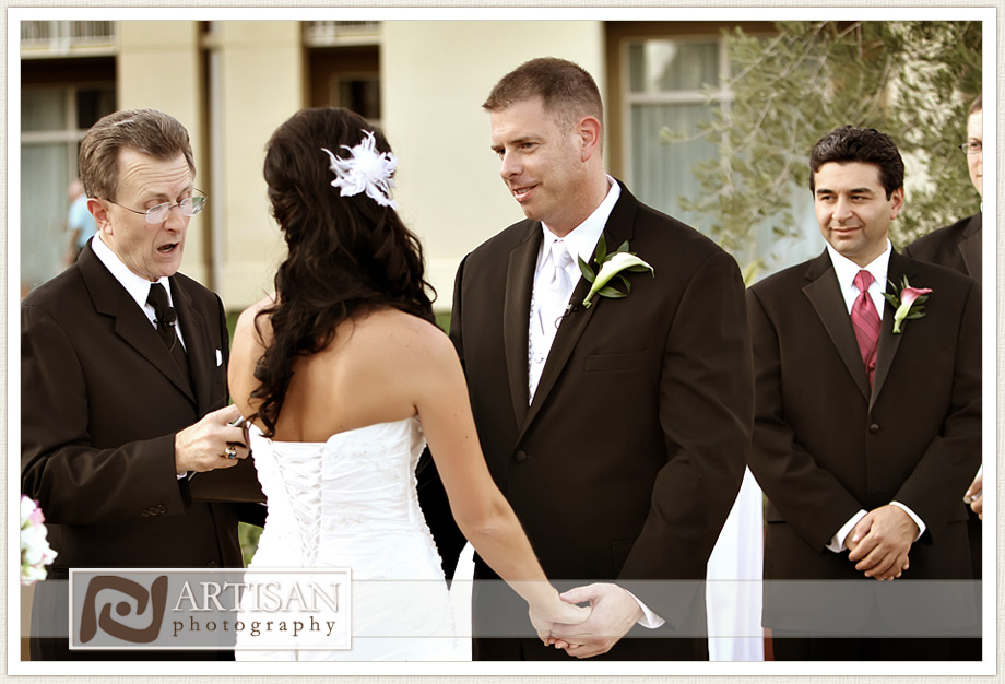 bride and groom holding hands during ceremony