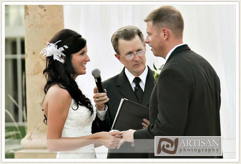 bride and groom exchanging rings during ceremony