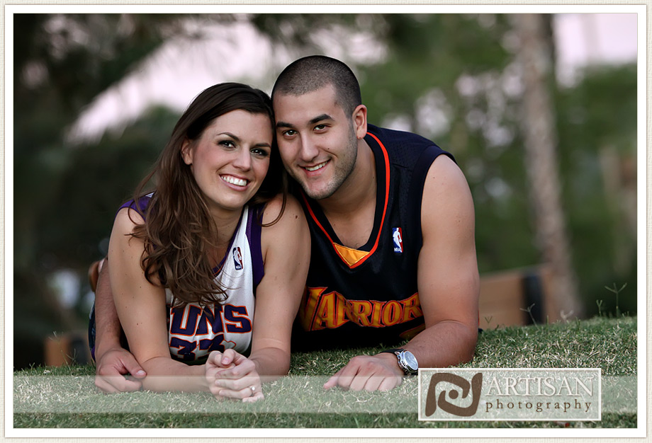 engagement photos at the park in Gilbert couple with sports jerseys