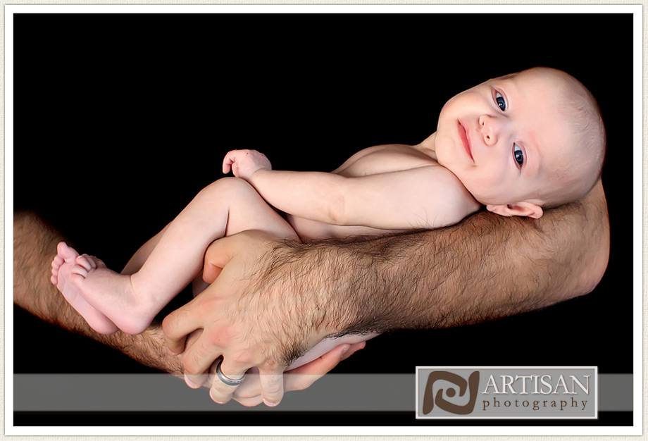 Anne Guedes style image of baby girl in dads arms