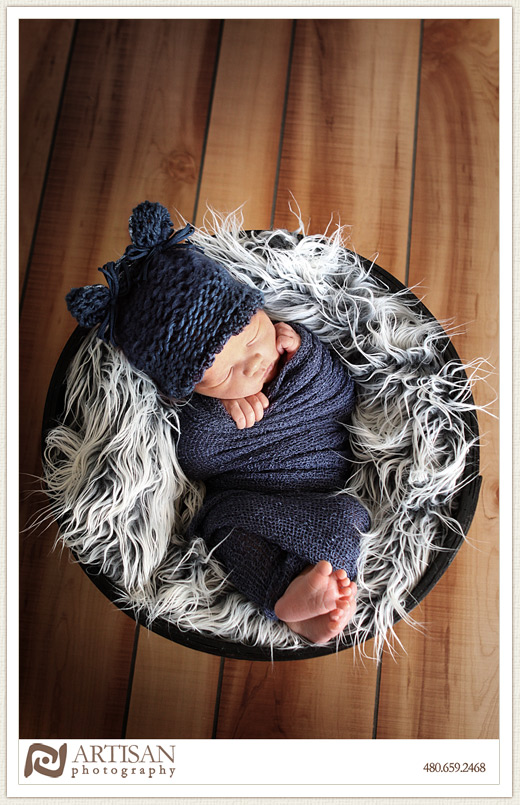 baby in basket with fluffy rug