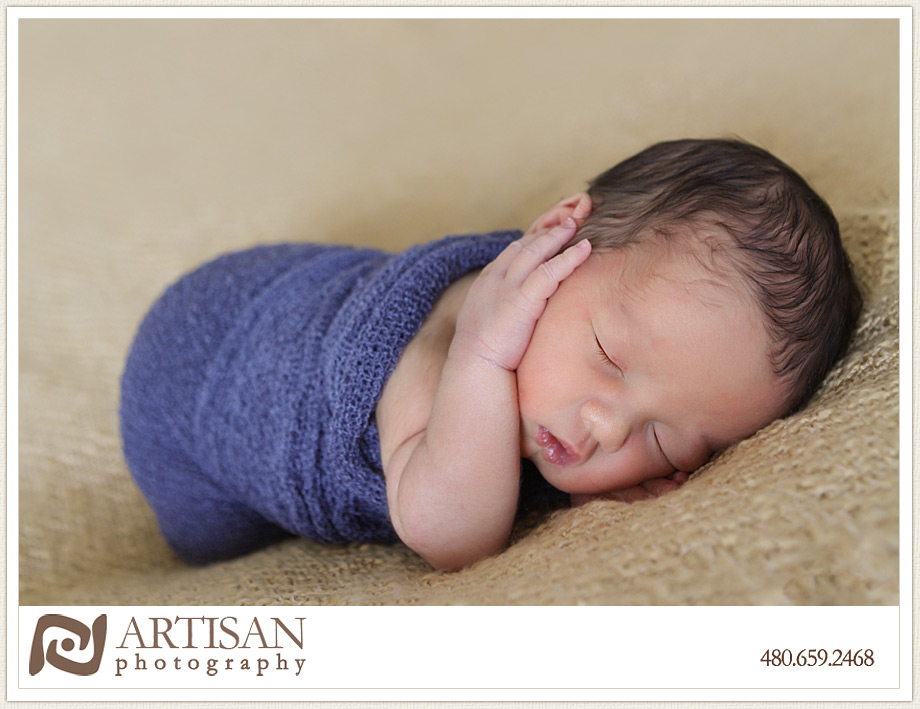 baby in blue wrap sleeping