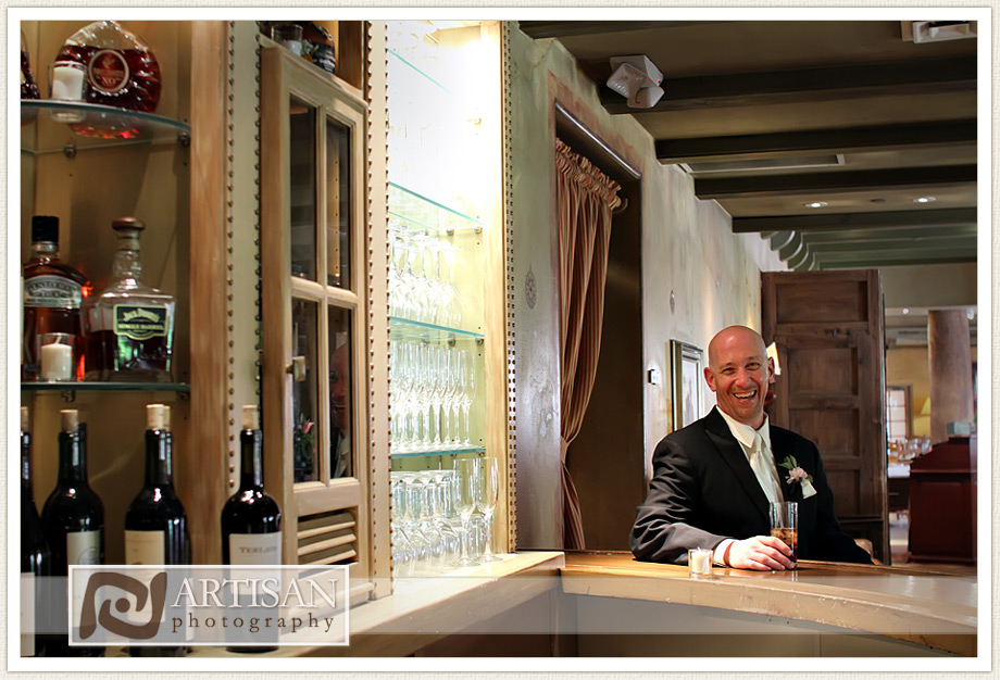 Royal Palms Wedding image of groom by the bar 
