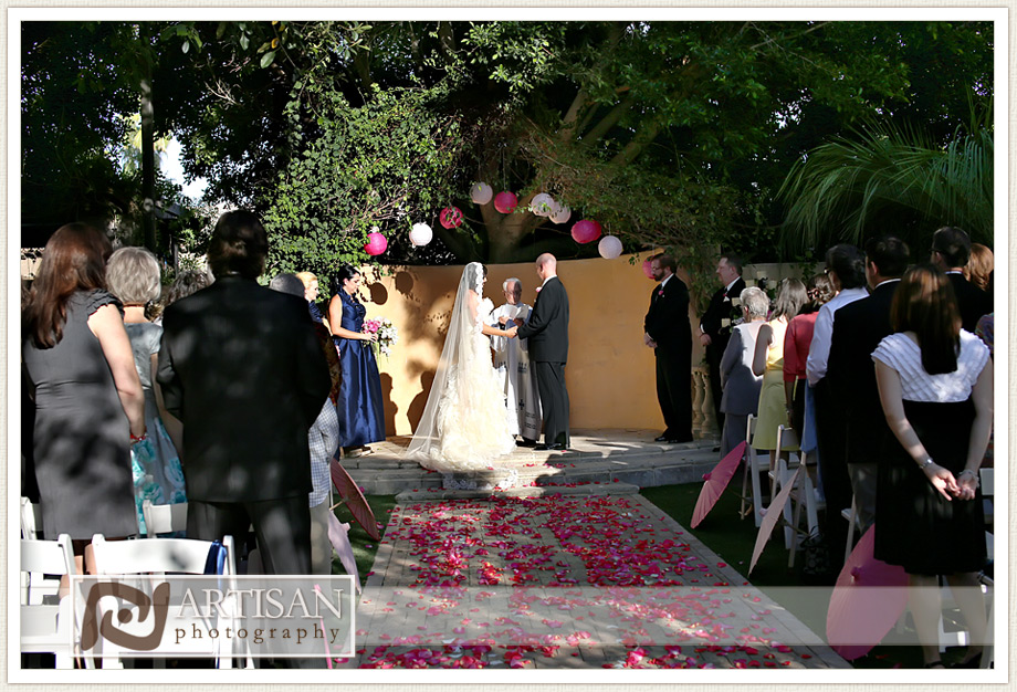 Royal Palms Wedding image of  wedding ceremony with pink flowers on the aisle