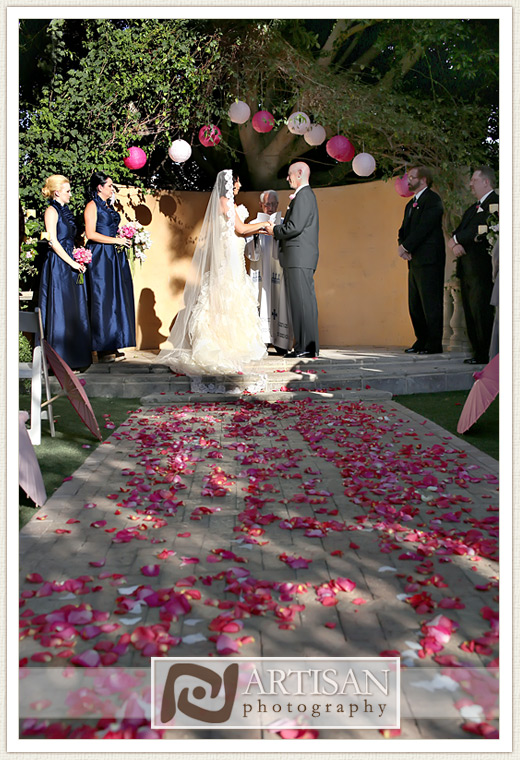Royal Palms Wedding image of  wedding ceremony with pink flowers on the aisle