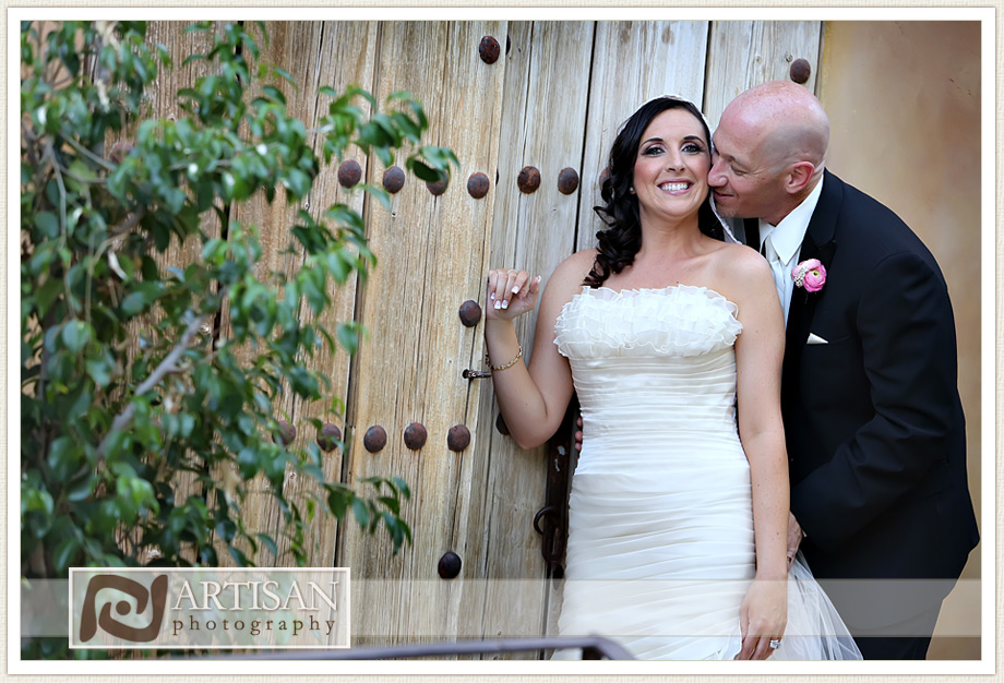 Royal Palms Wedding image of bride and groom in front of rustic wooden door