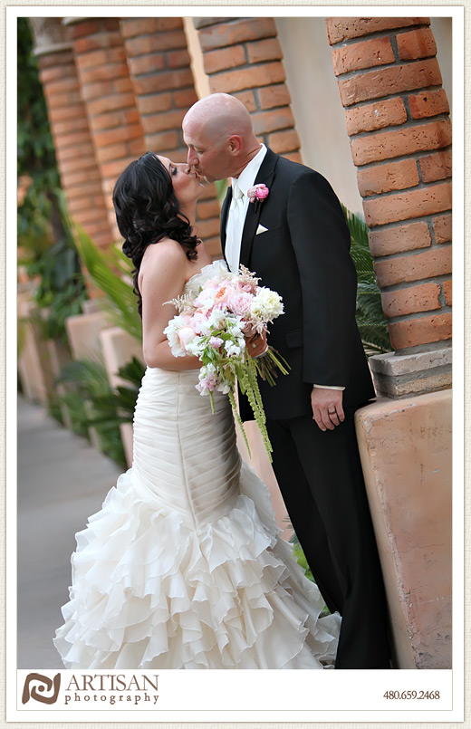Royal Palms Wedding image of  bride and groom on walkway with pillars 
