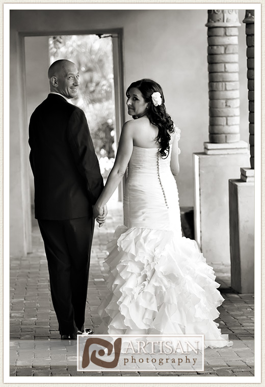 Royal Palms Wedding image of Bride and groom looking back, smiling 