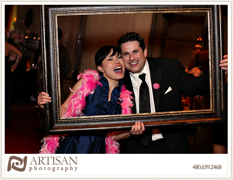 Royal Palms Wedding image of couple with picture frame making faces
