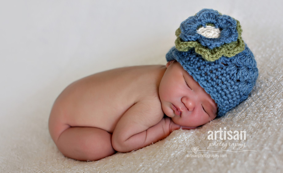 newborn baby girl with vintage blue hat