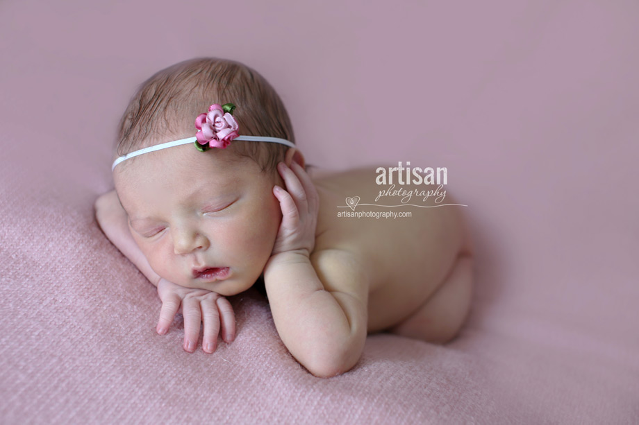 newborn baby girl photo at our Carlsbad studio in California with super cute little pink rose headband