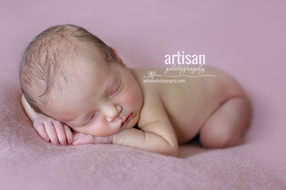 newborn baby girl photo at our Carlsbad studio in California in dusty pink background