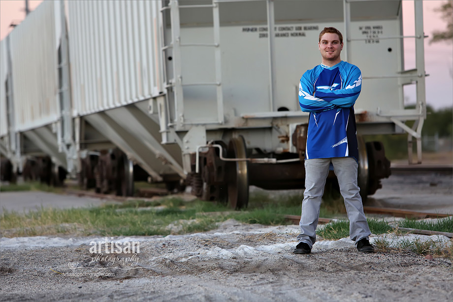 High school senior boy photo in front of train