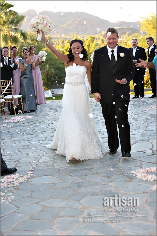 bride and groom showered with petals