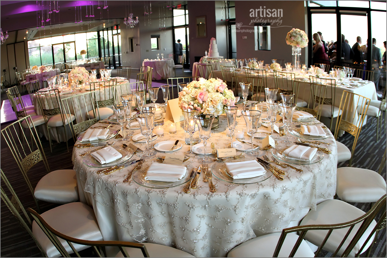 Sanctuary Camelback Mountain Resort ballroom decorated for a wedding with up lighting and fancy linens