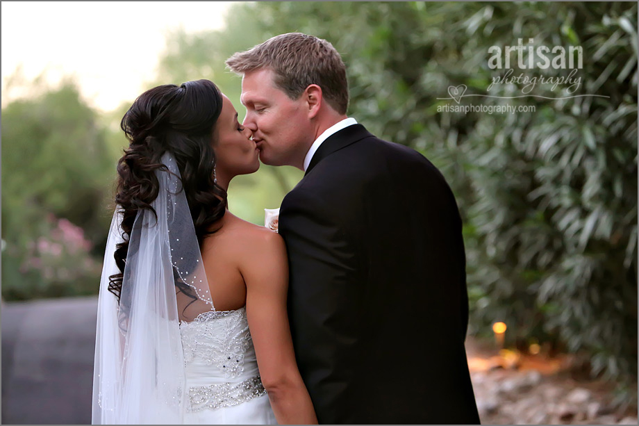 Bride and groom kissing