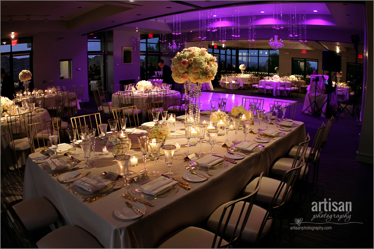 Sanctuary Camelback Mountain Resort ballroom decorated for a wedding with up lighting and fancy linens