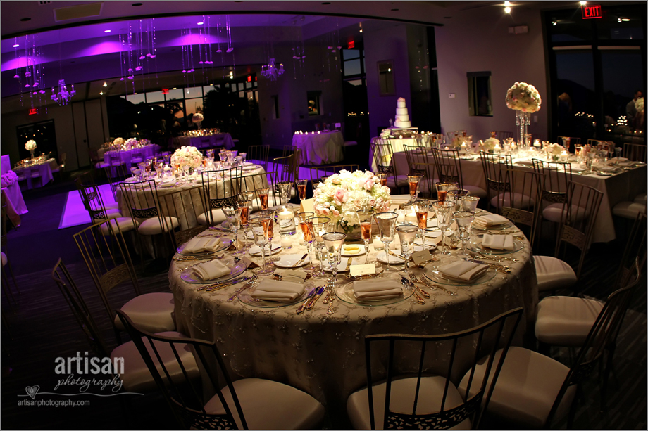 Sanctuary Camelback Mountain Resort ballroom decorated for a wedding with up lighting and fancy linens