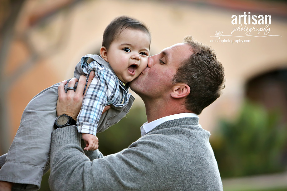 Father kissing baby