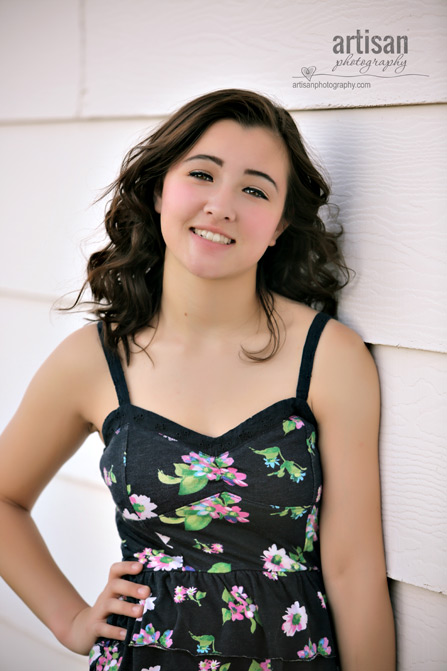 High School Senior photo of Girl on white wall