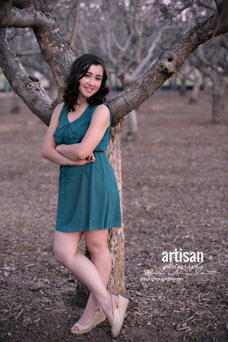 High School Senior photo of girl on a orchard