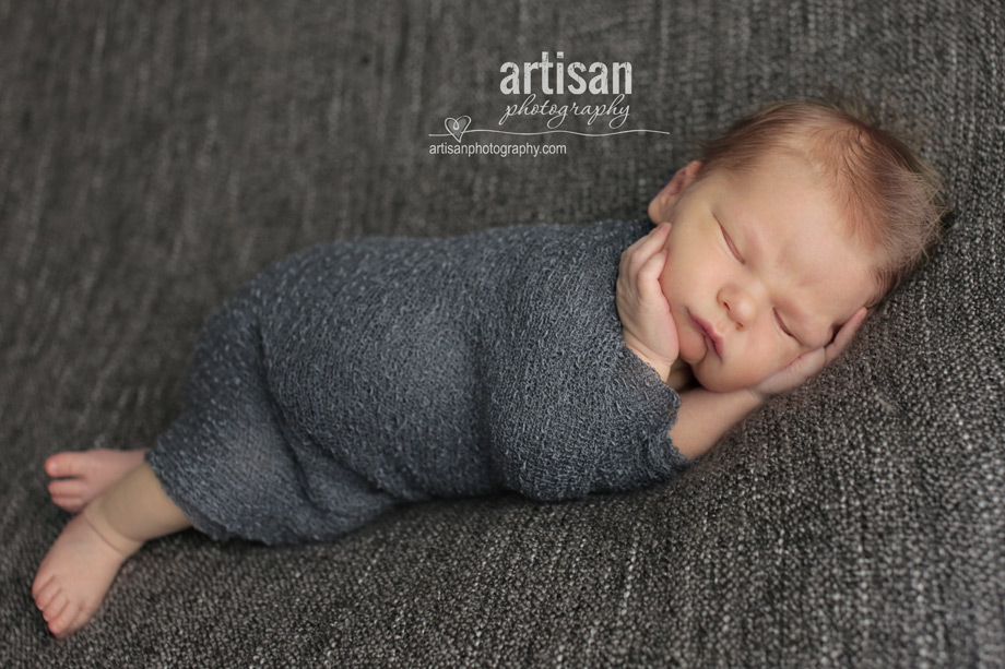 professional photo of newborn baby on grey background blanket