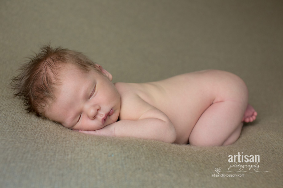 professional photo of newborn baby on beige blanket