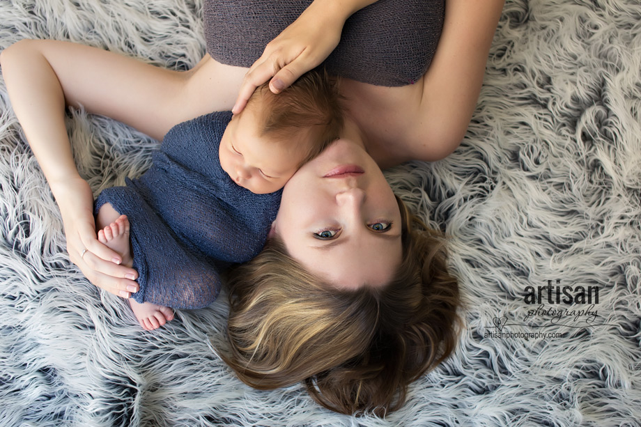 professional photo of newborn baby and mom