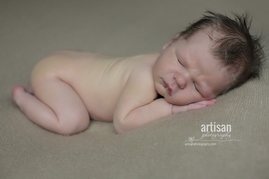 professional photo of newborn baby on beige background blanket