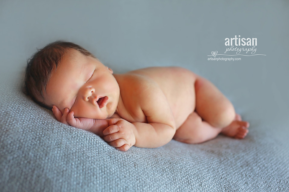 newborn baby boy photo laying on a blue blanket in Carlsbad California