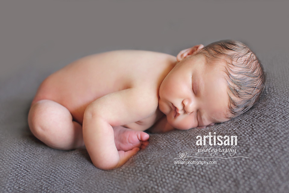 newborn baby boy photo laying on a grey blanket in Carlsbad California