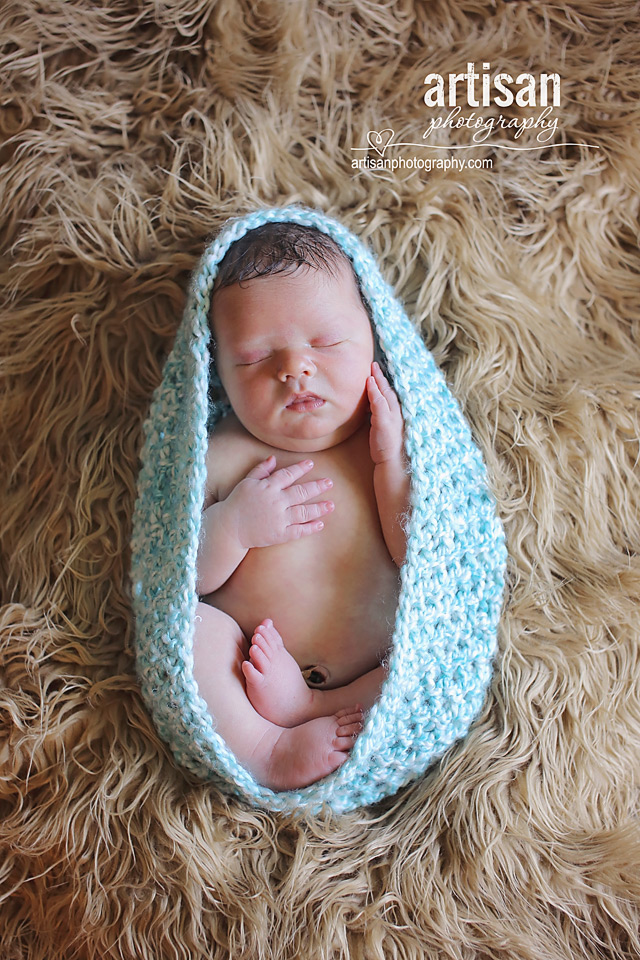 newborn baby boy photo laying on a blue bowl in Carlsbad California