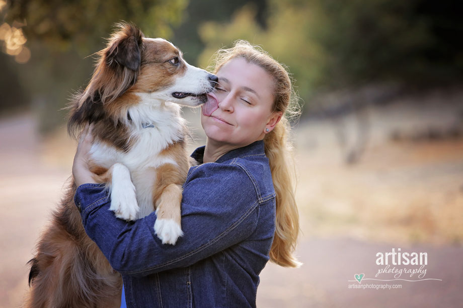 Cute puppy dog giving kisses to his owner