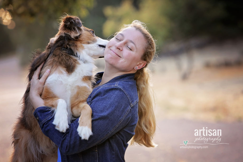 Cute puppy dog giving kisses to his owner