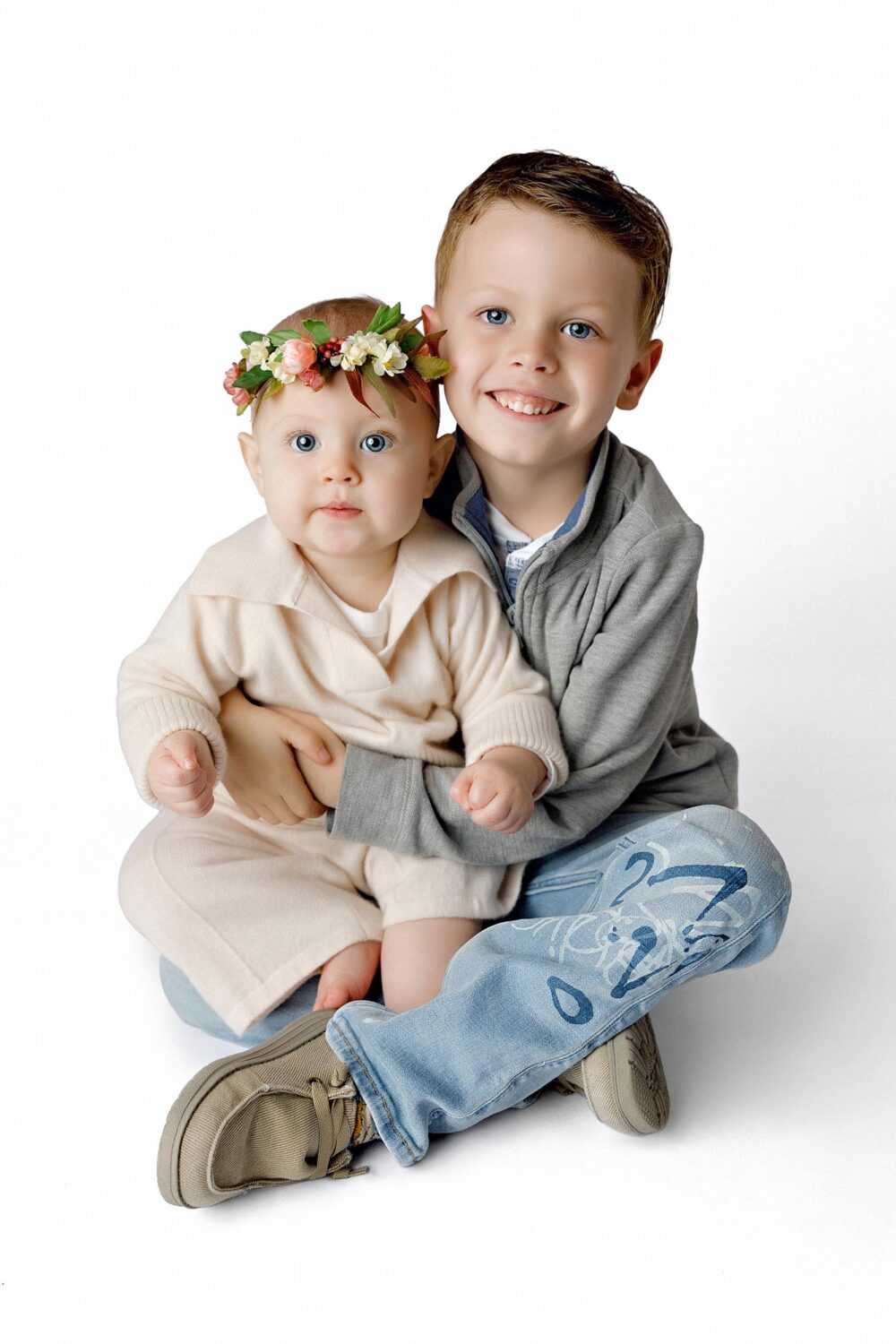 cute siblings portrait in studio