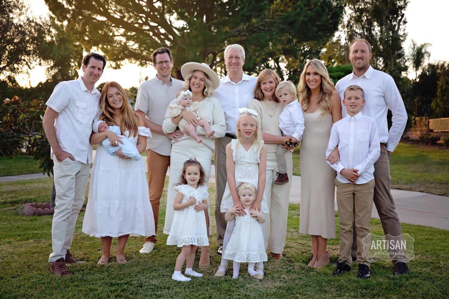 Extended Family all wearing cream, white and beige. 8 adults and 7 kids. Beautiful family