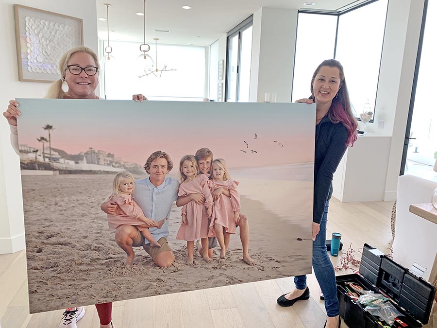 30x40 Canvas held by two people